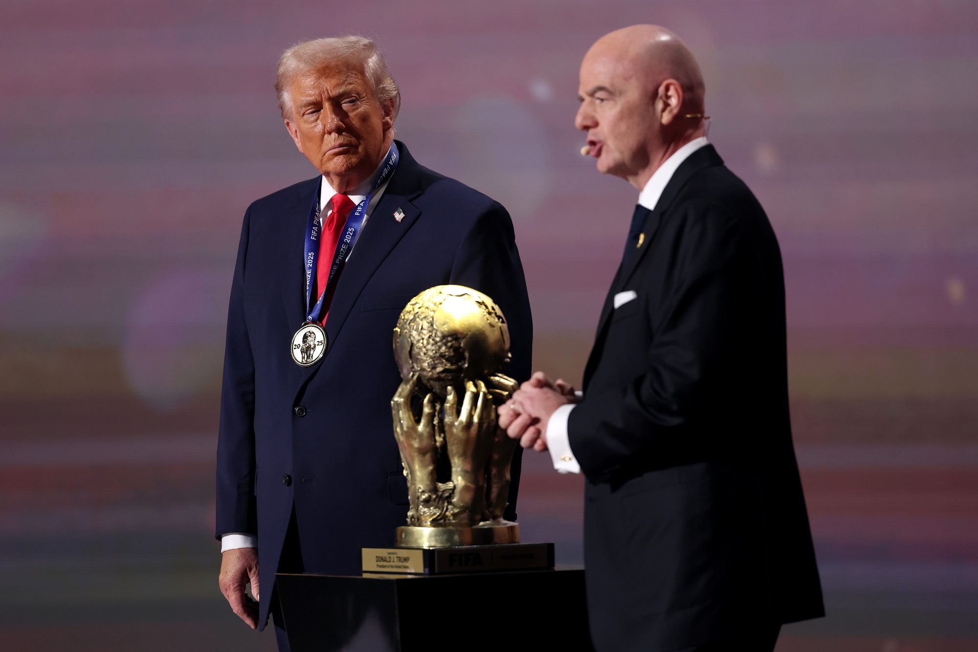 WASHINGTON, DC - DECEMBER 05: U.S. President Donald Trump receives the FIFA Peace Prize from Gianni Infantino, President of FIFA, during the FIFA World Cup 2026 Official Draw at John F. Kennedy Center for the Performing Arts on December 05, 2025 in Washington, DC. (Photo by Patrick Smith/Getty Images) Photographer: Patrick Smith/Getty Images North America
