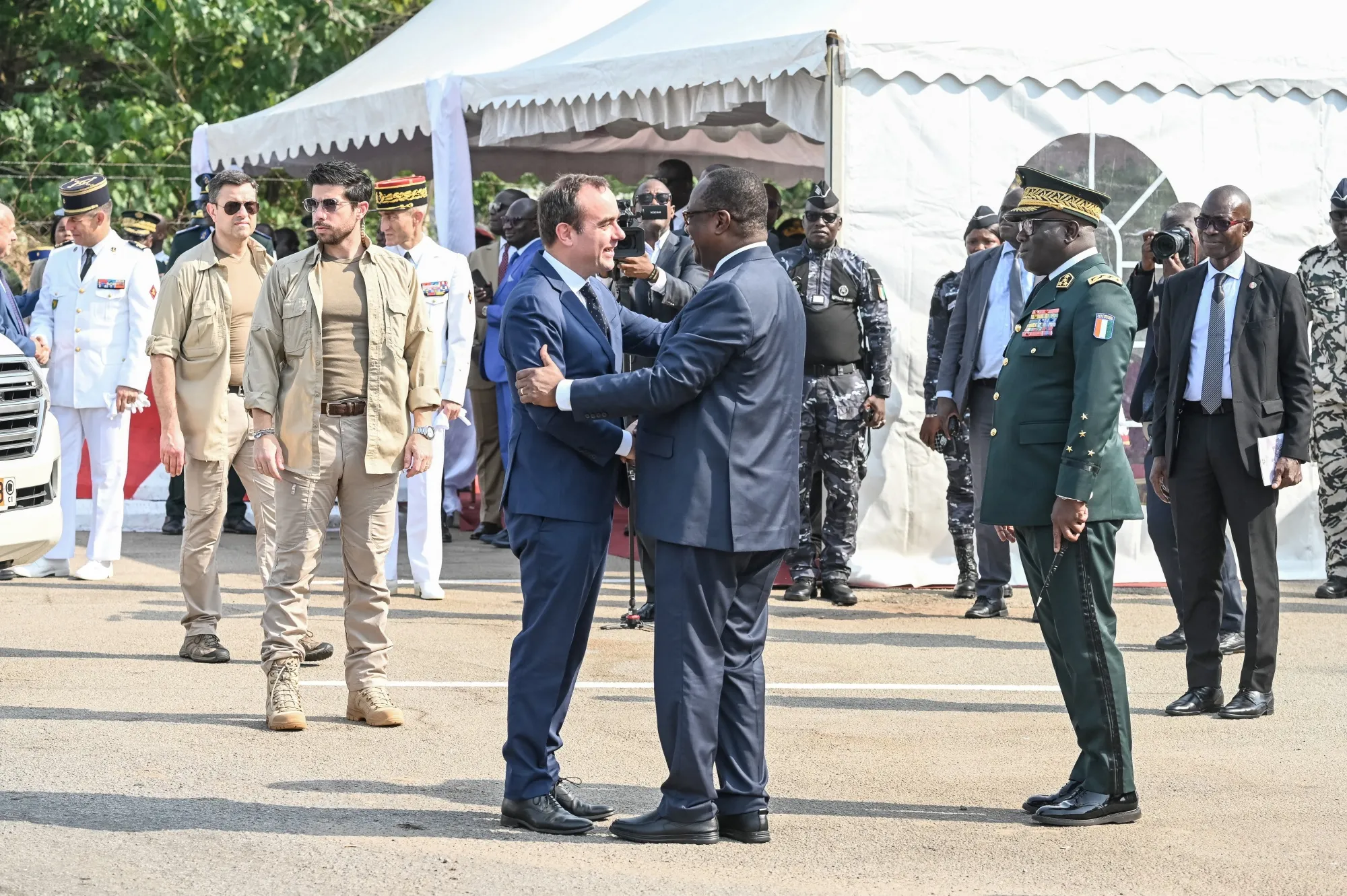 France's Minister of Armed Forces Sebastien Lecornu and Defence Minister of Ivory Coast Tene Birahima Ouattara&nbsp;during a ceremony at the 43rd Marine Infantry Battalion in Port-Bouet in Abidjan on February 20.