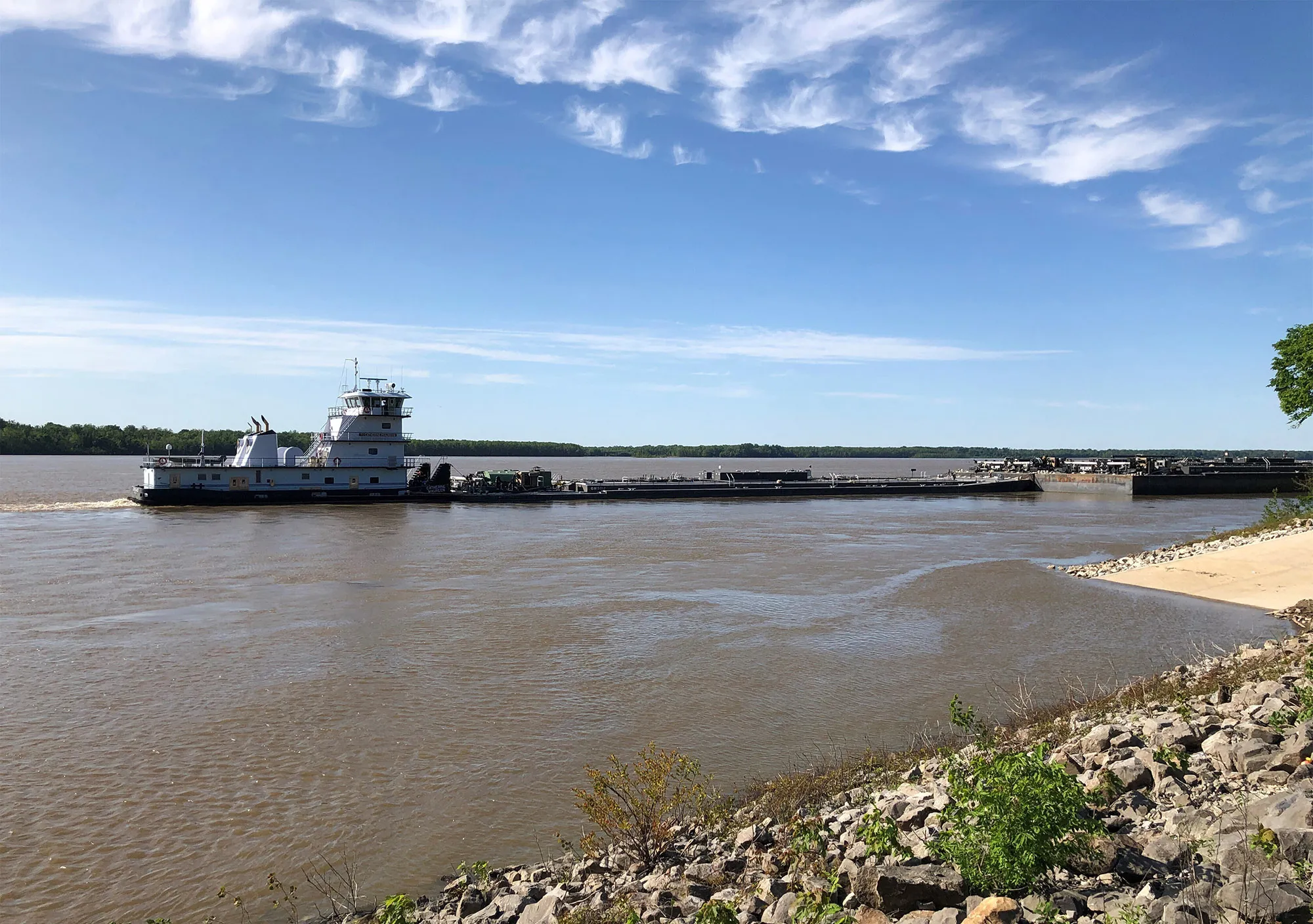 A tugboat with a barge attached waits near a boat ramp at Meeman-Shelby Forest State Park, May 12.&nbsp;