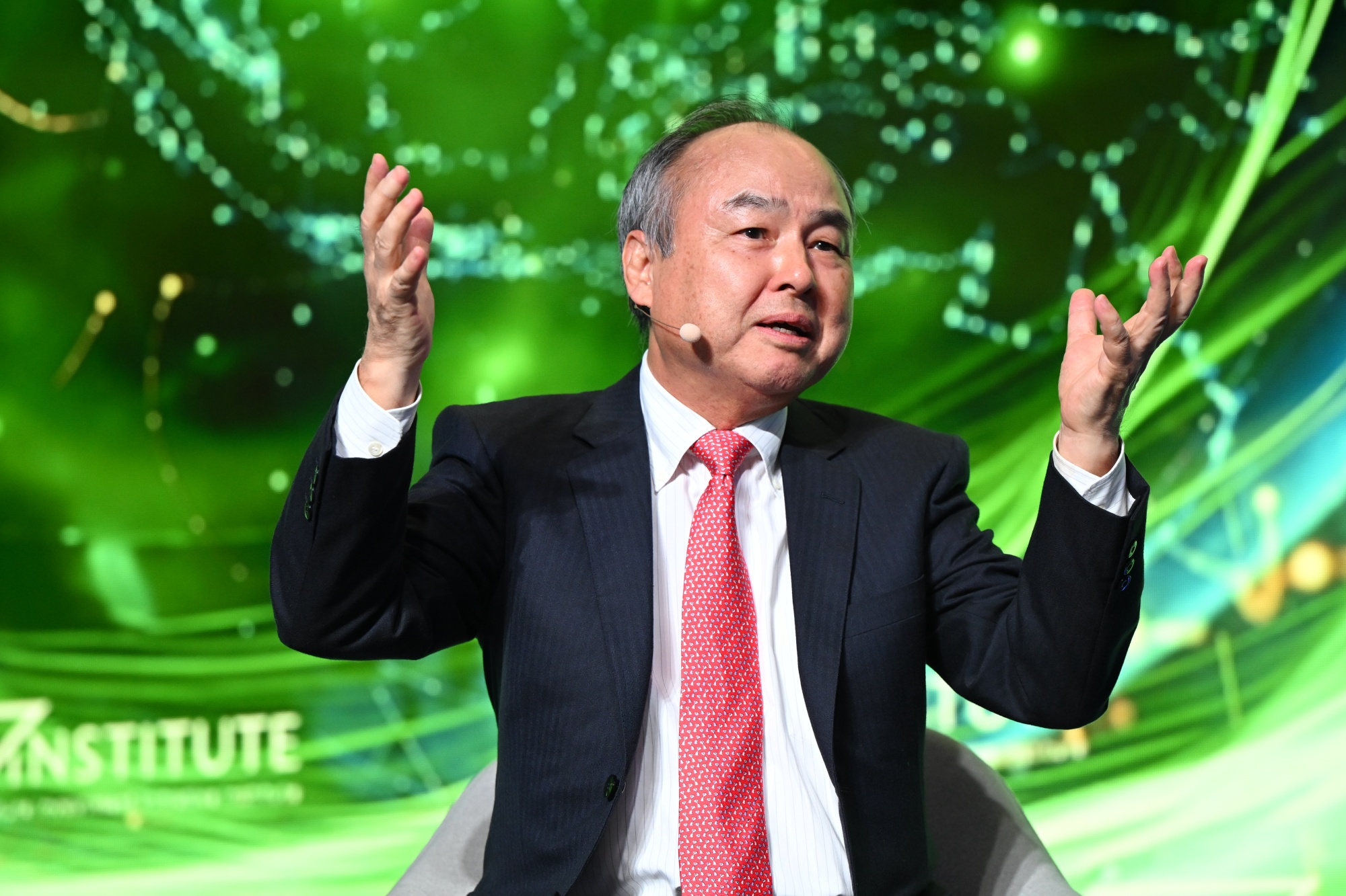 Masayoshi Son, chairman and chief executive officer of SoftBank Group Corp., speaks during the Future Investment Initiative (FII) Institute Priority Asia conference in Tokyo, Japan, on Monday, Dec. 1, 2025. The two-day conference is scheduled to conclude today. Photographer: Akio Kon/Bloomberg
