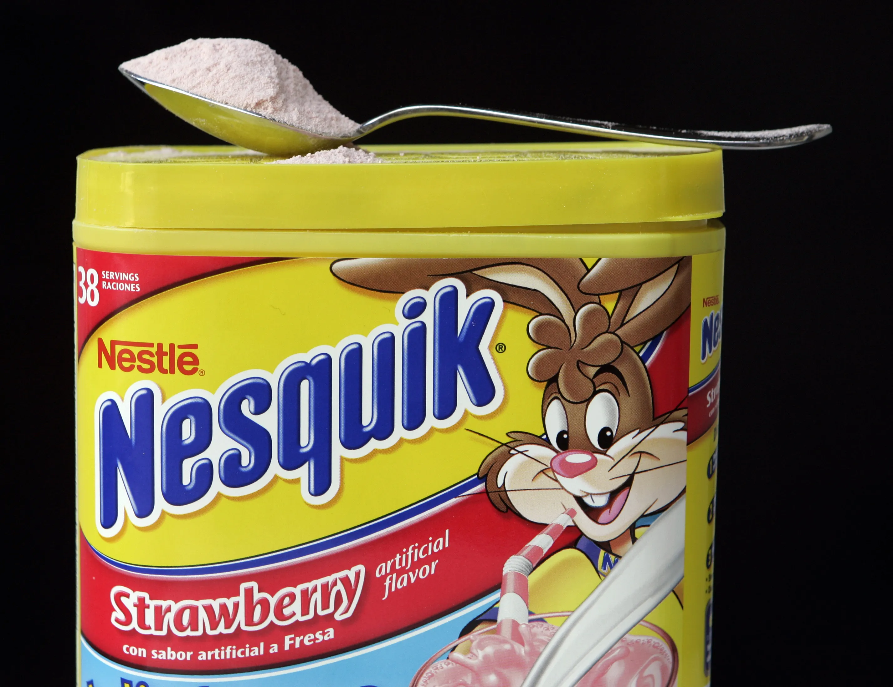 A container of Nestle Nesquik Strawberry Powder.