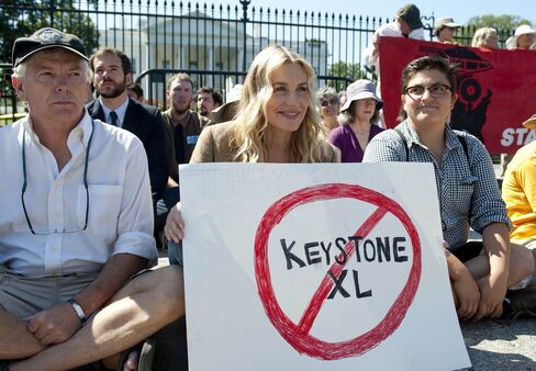 American actress Daryl Hannah sits in front of the White House during a protest against the construction of the Keystone XL pipeline.