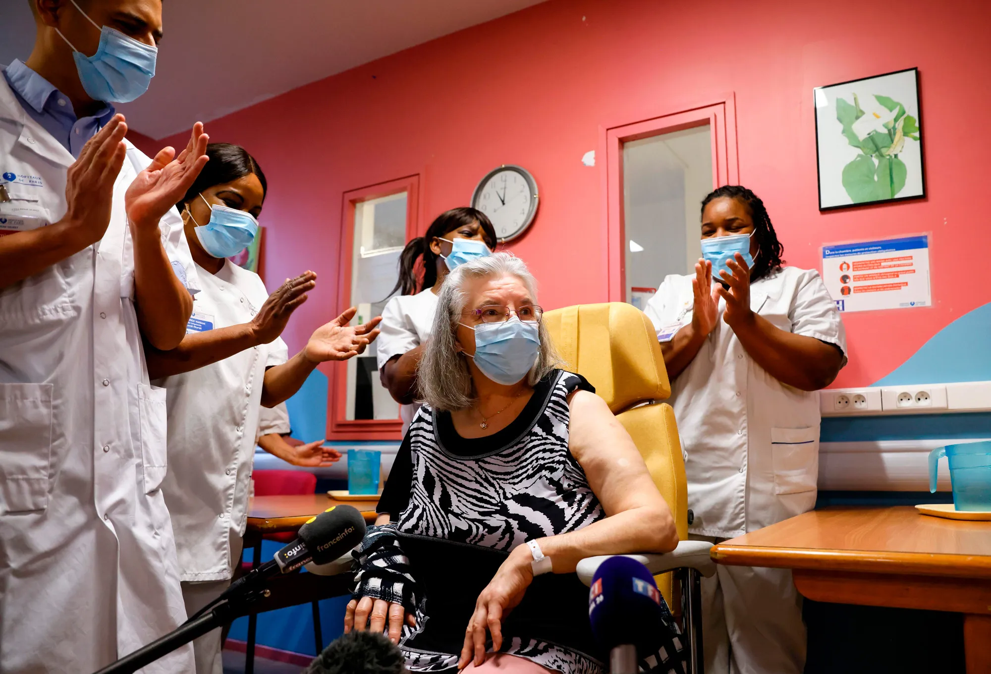 Mauricette is applauded after receiving France’s first Covid-19 vaccine dose at Rene-Muret hospital near Paris, on Dec. 27.