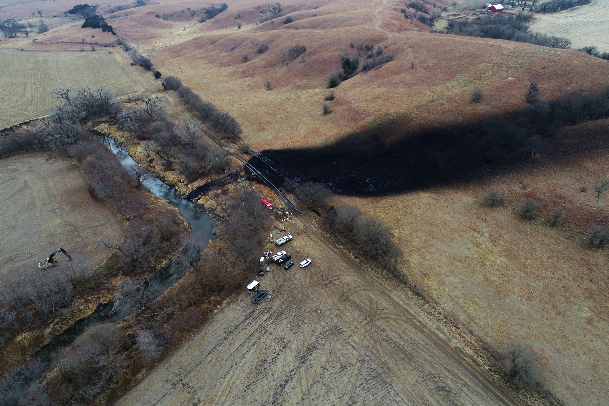 Cleanup efforts in the area where the ruptured Keystone pipeline dumped oil into a creek in Washington County, Kan., Dec. 9, 2022.