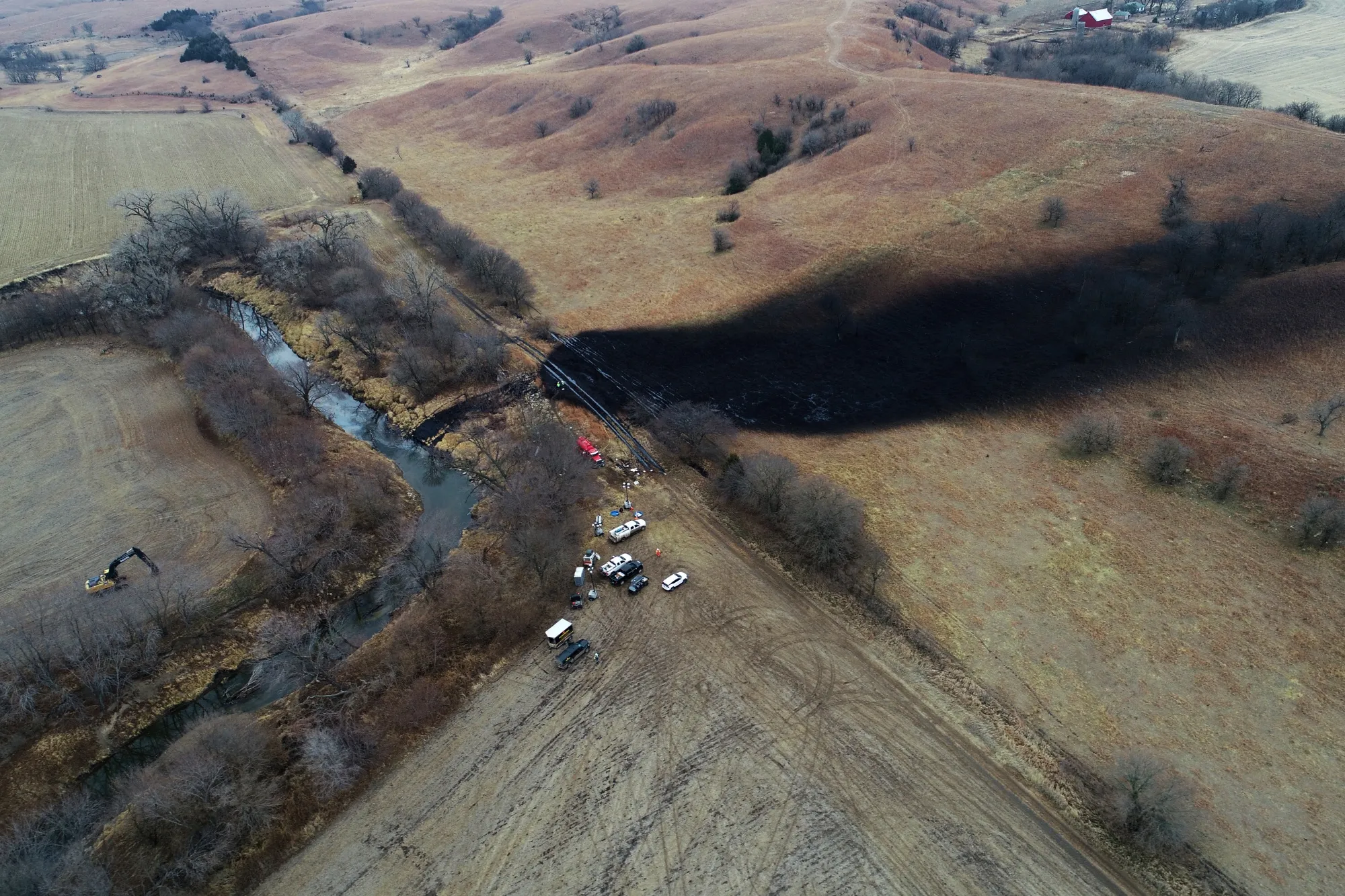 Cleanup efforts in the area where the ruptured Keystone pipeline dumped oil into a creek in Washington County, Kan., Dec. 9, 2022.