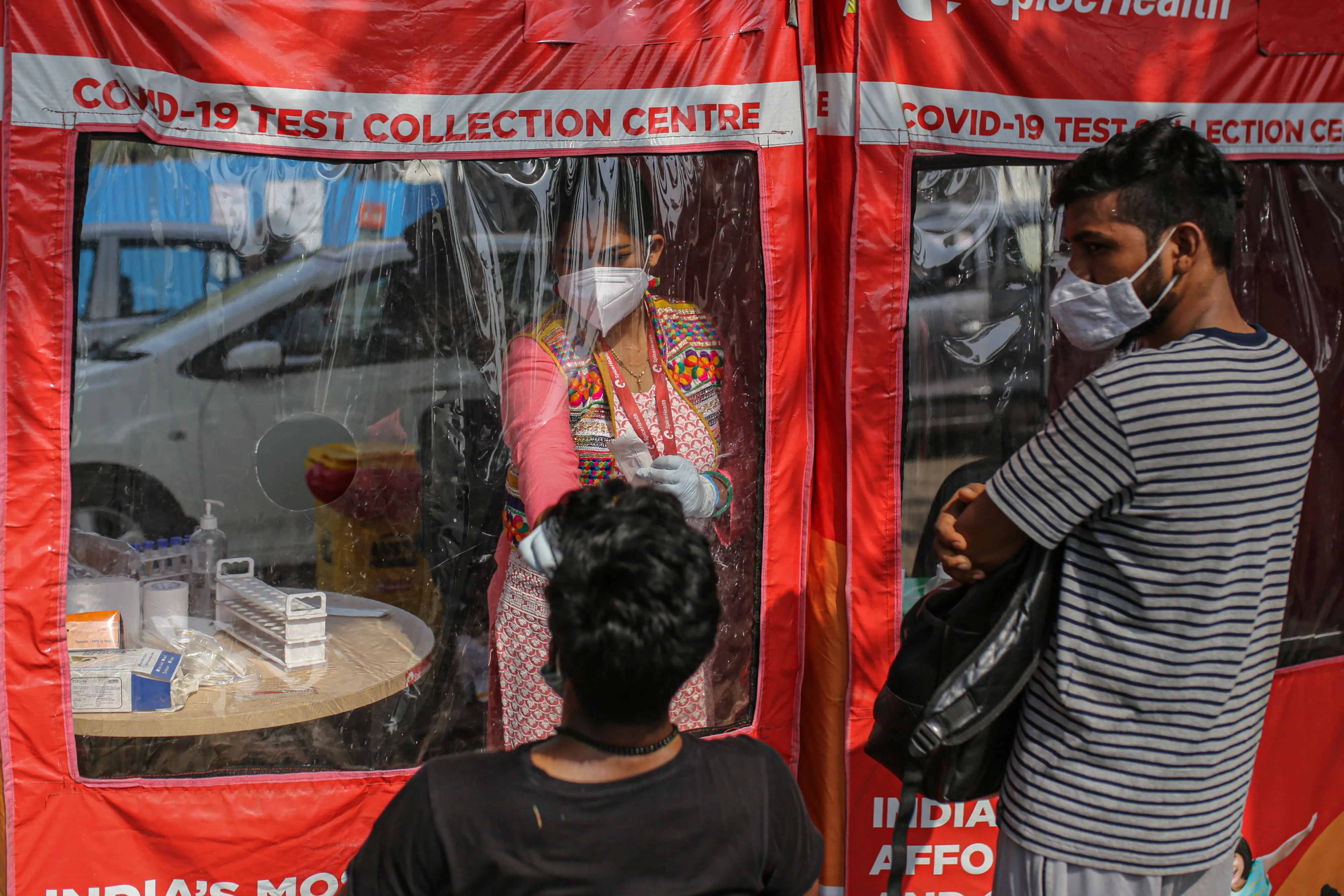 A health worker takes a swab at a Covid-19 testing site set up in the Goregaon suburb of Mumbai on April 27.