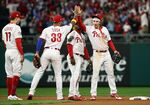 The Philadelphia Phillies celebrate after defeating the Houston Astros 7-0 in Game Three of the 2022 World Series.