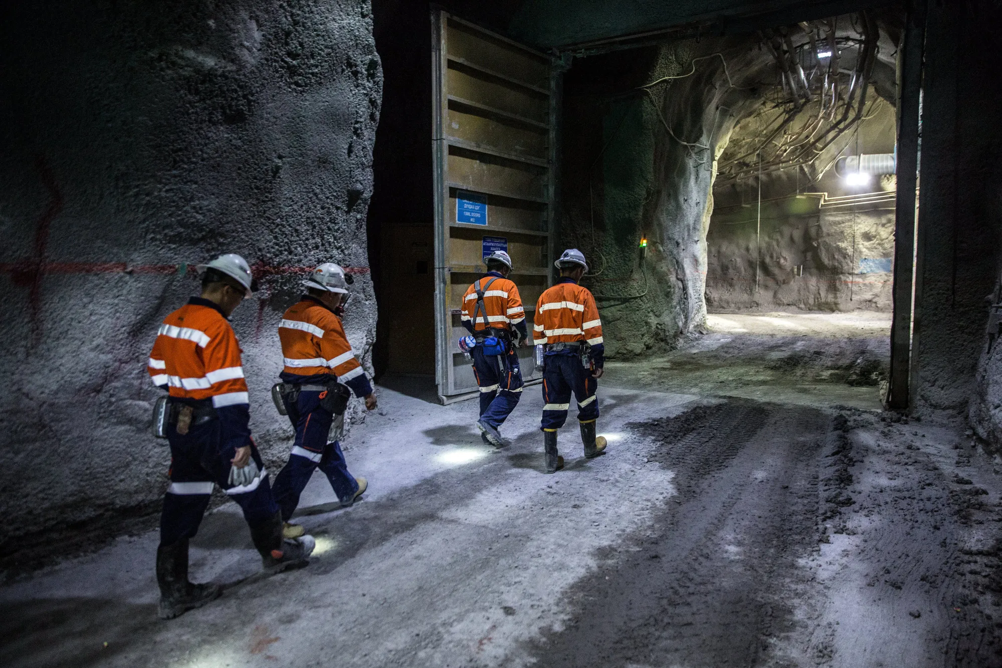 Workers walk through a tunnel at a copper-gold mine&nbsp;in Khanbogd, the South Gobi desert, Mongolia.