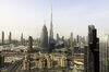 The Burj Khalifa skyscraper, center, towers above commercial and residential properties in Dubai, United Arab Emirates, on Tuesday, July 23, 2019. Like the rest of the city, the business center has suffered from a prolonged real-estate slump brought on by oversupply and slower economic growth.