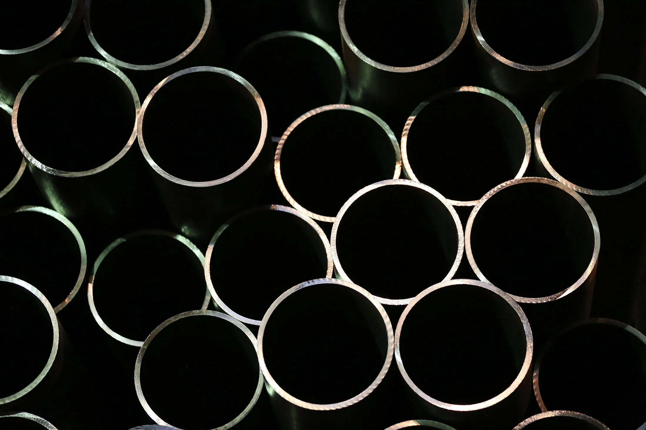 Seamless steel pipes for use in oil and gas pipelines sit in a storage area at a manufacturing plant in Volzhsky, Russia.
