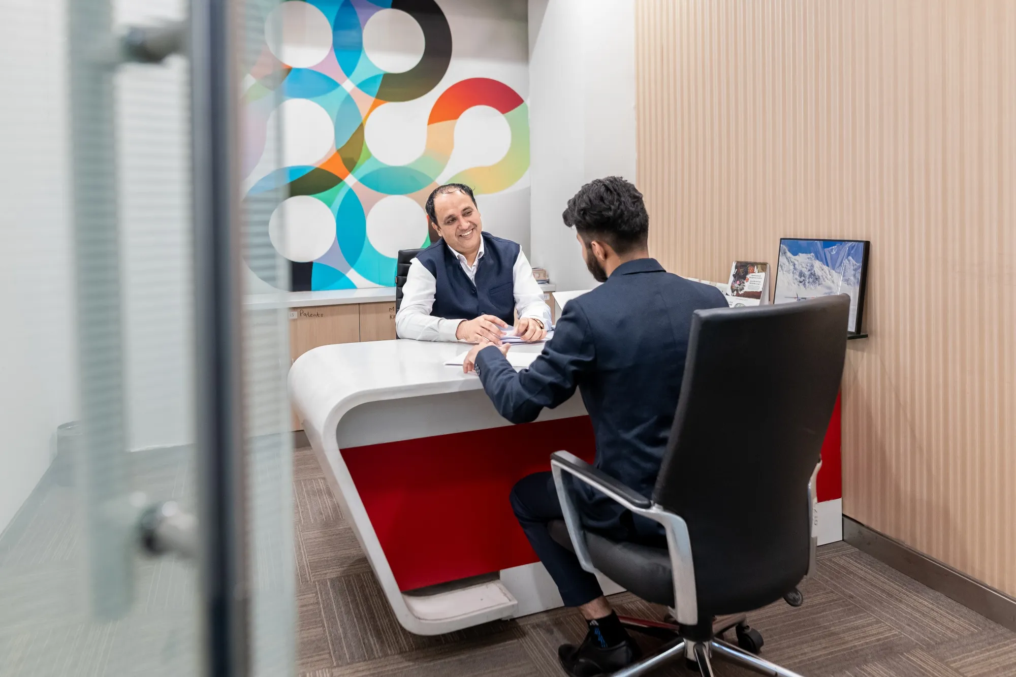 A recruiter speaks with an MBA student during an one-on-one interview as a part of a college recruitment event in Greater Noida, Uttar Pradesh, India.