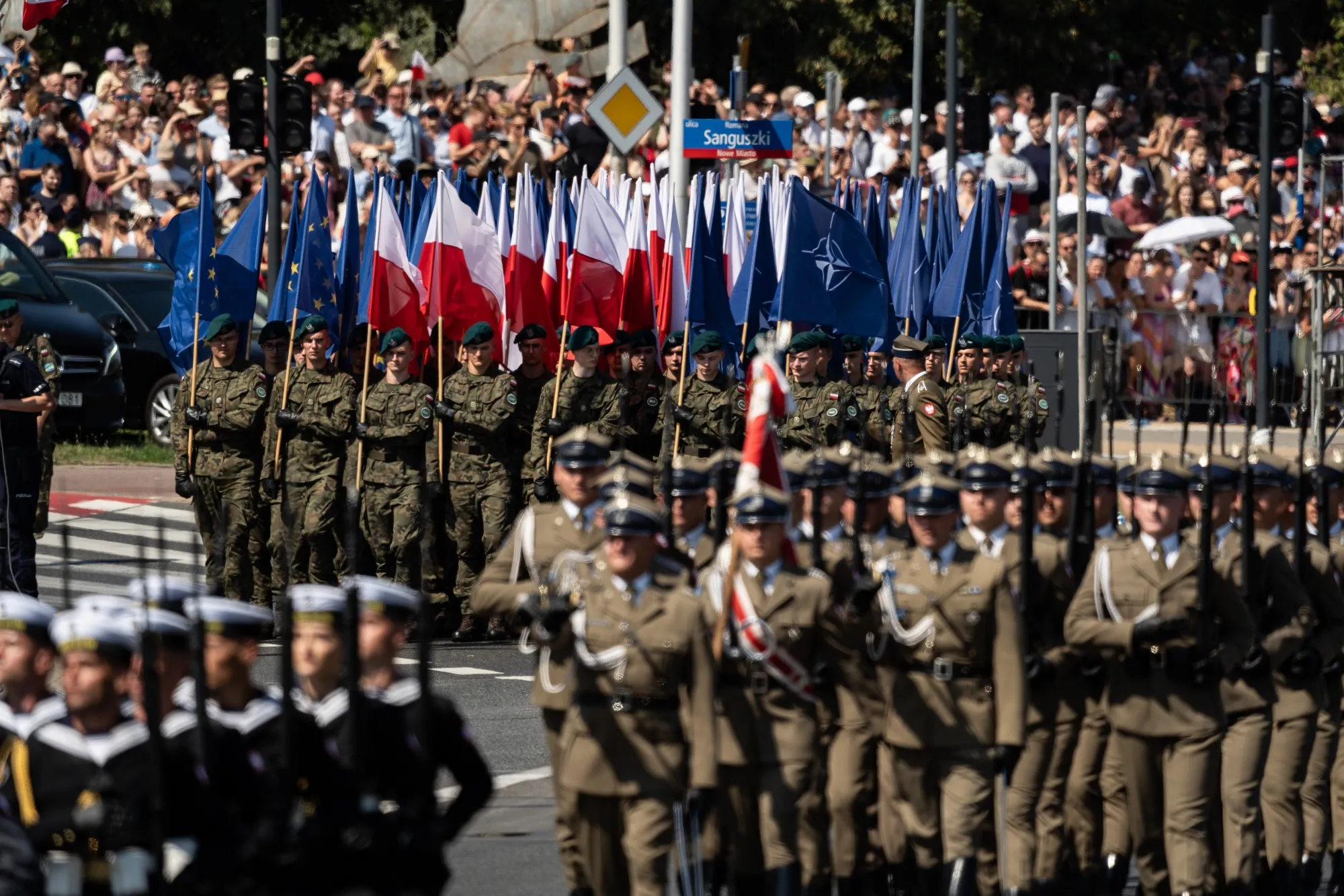 Soldiers carry the flags of Poland, the European Union and the North Atlantic Treaty Organisation during the Polish Army Parade in Warsaw.