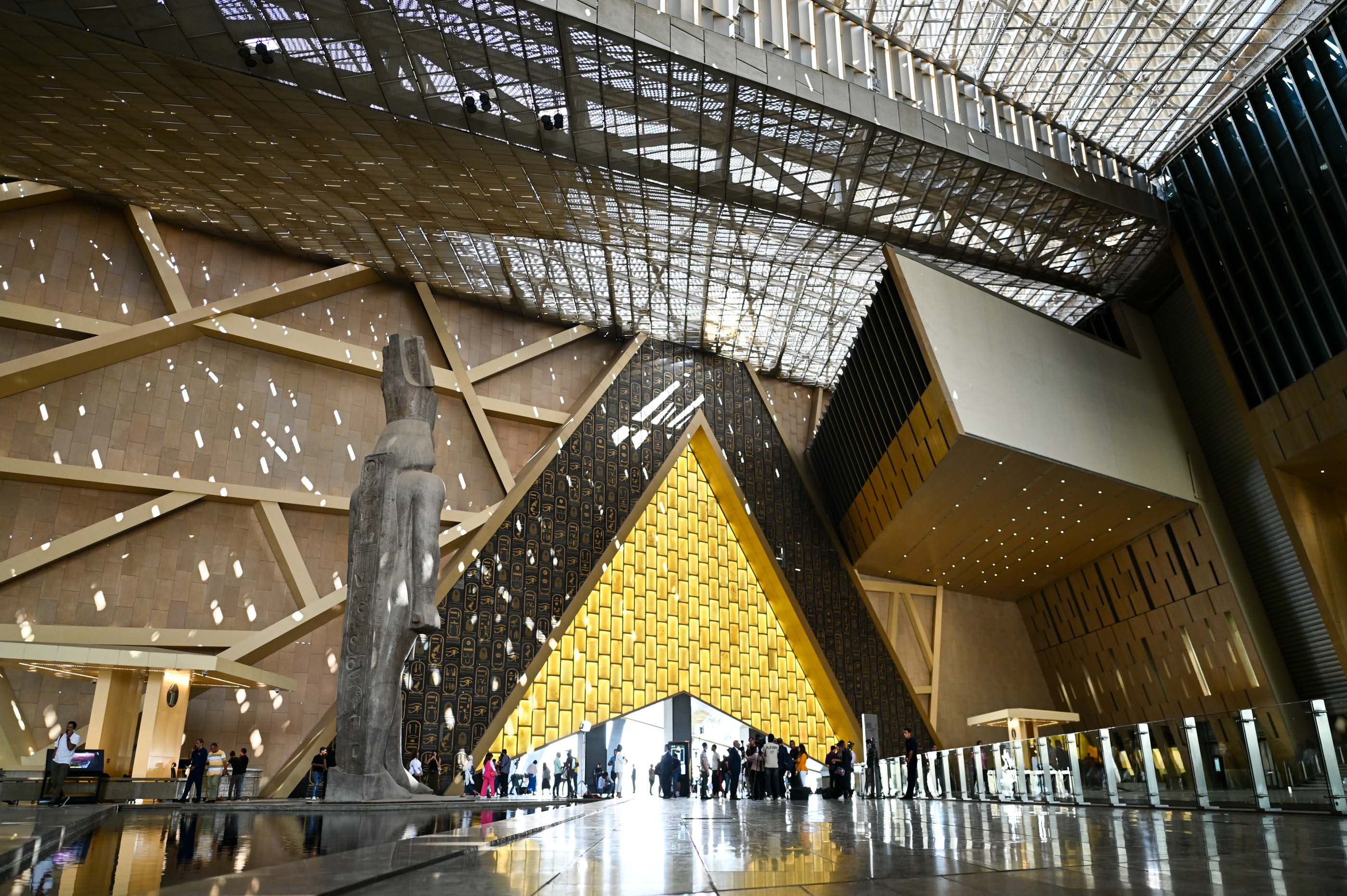 A giant golden triangle evokes the pyramids in the Grand Egyptian Museum in Giza.
