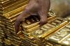 An employee arranges one kilogram gold bars for a photograph at the YLG Bullion International Co. headquarters in Bangkok, Thailand, on Wednesday, Jan. 13, 2016. Thailand's biggest buyer of gold will boost purchases by about 25 percent to 160 tons this year, said chief executive officer Pawan Nawawattanasub.