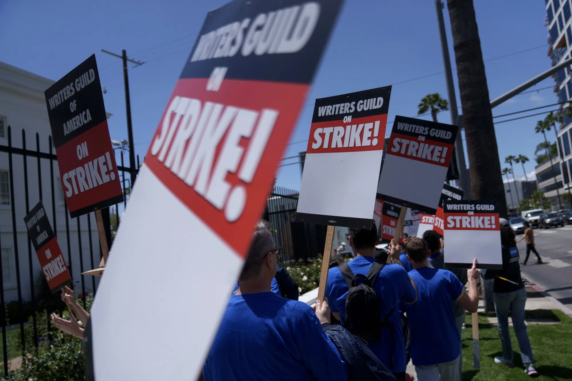 Striking Writers Guild of America workers picket outside the Sunset Bronson Studios building in Los Angeles on May 2.