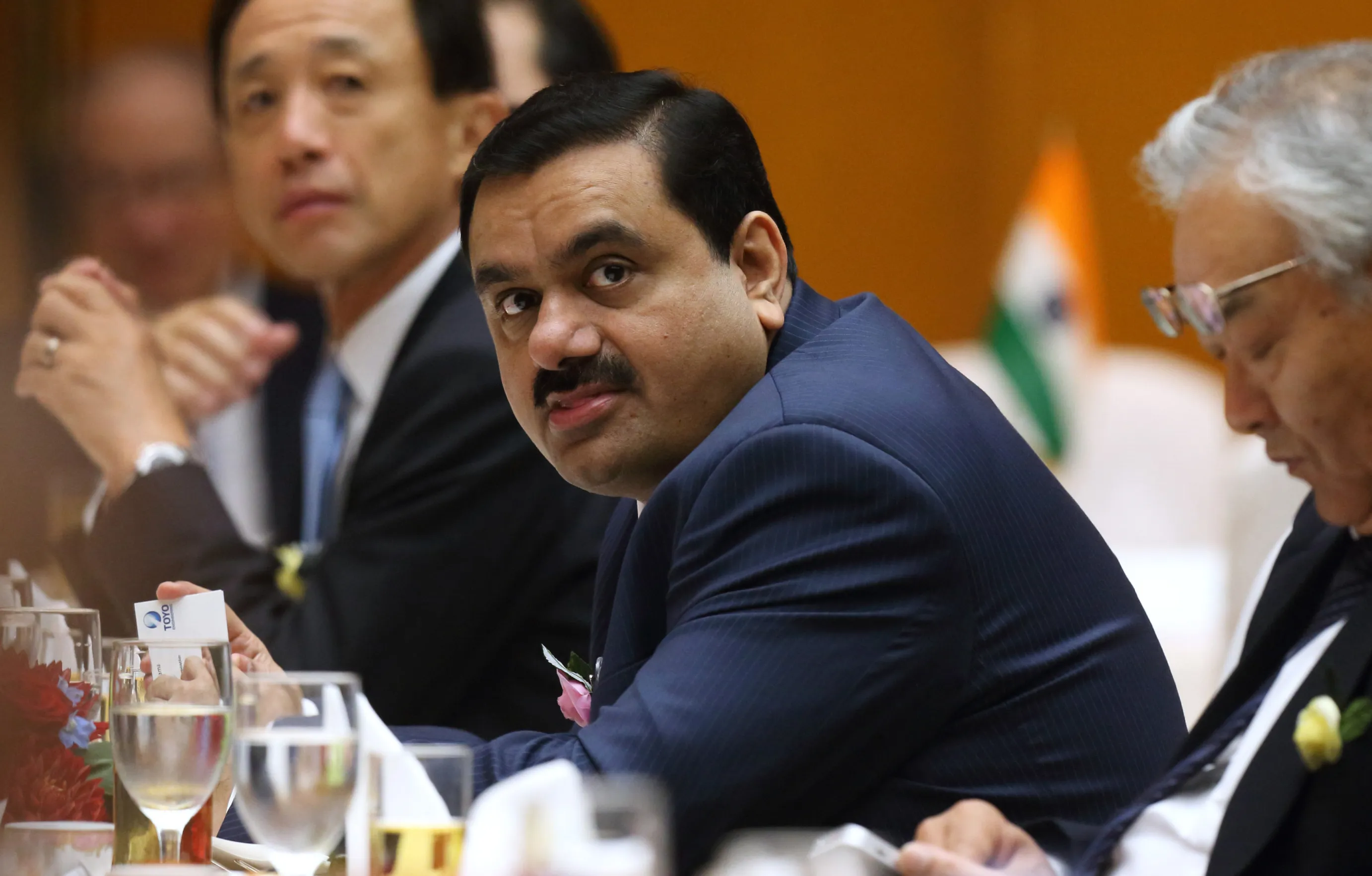  Gautam Adani, center.