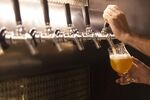 Beer is poured into a glass.