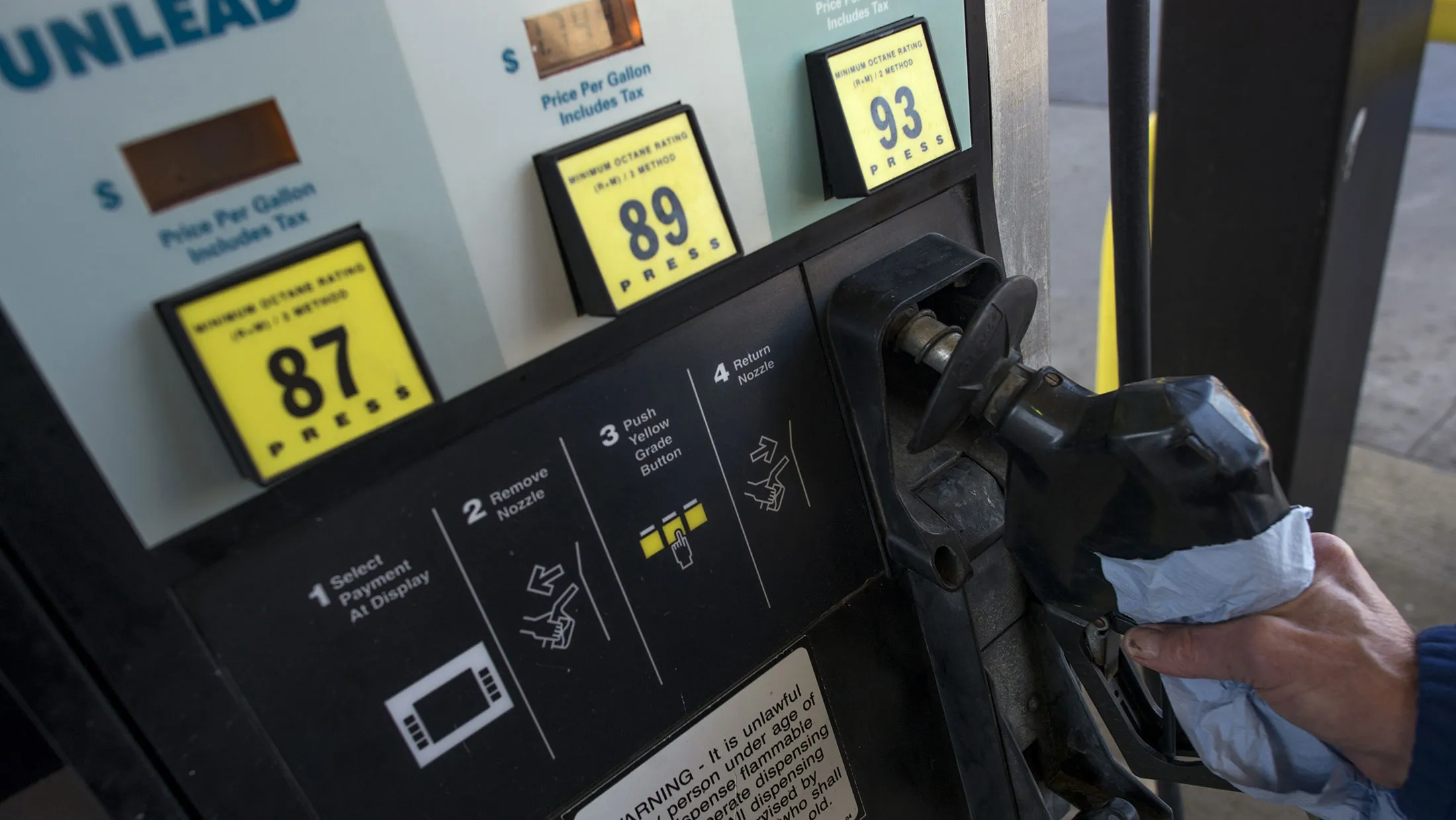 A customer prepares to pump fuel at a Go Mart Inc. gas station in Rockbridge, Ohio, U.S., on Saturday, Feb. 6, 2016.
