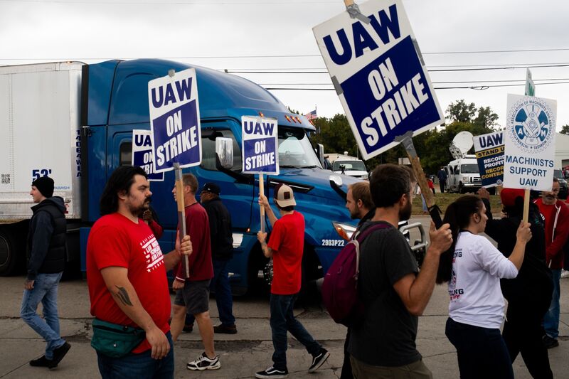 United Auto Workers (UAW) members and supporters attempt to block a truck from entering the Ford Motor Co. Michigan Assembly plant at a picket line in Wayne, Michigan, US,