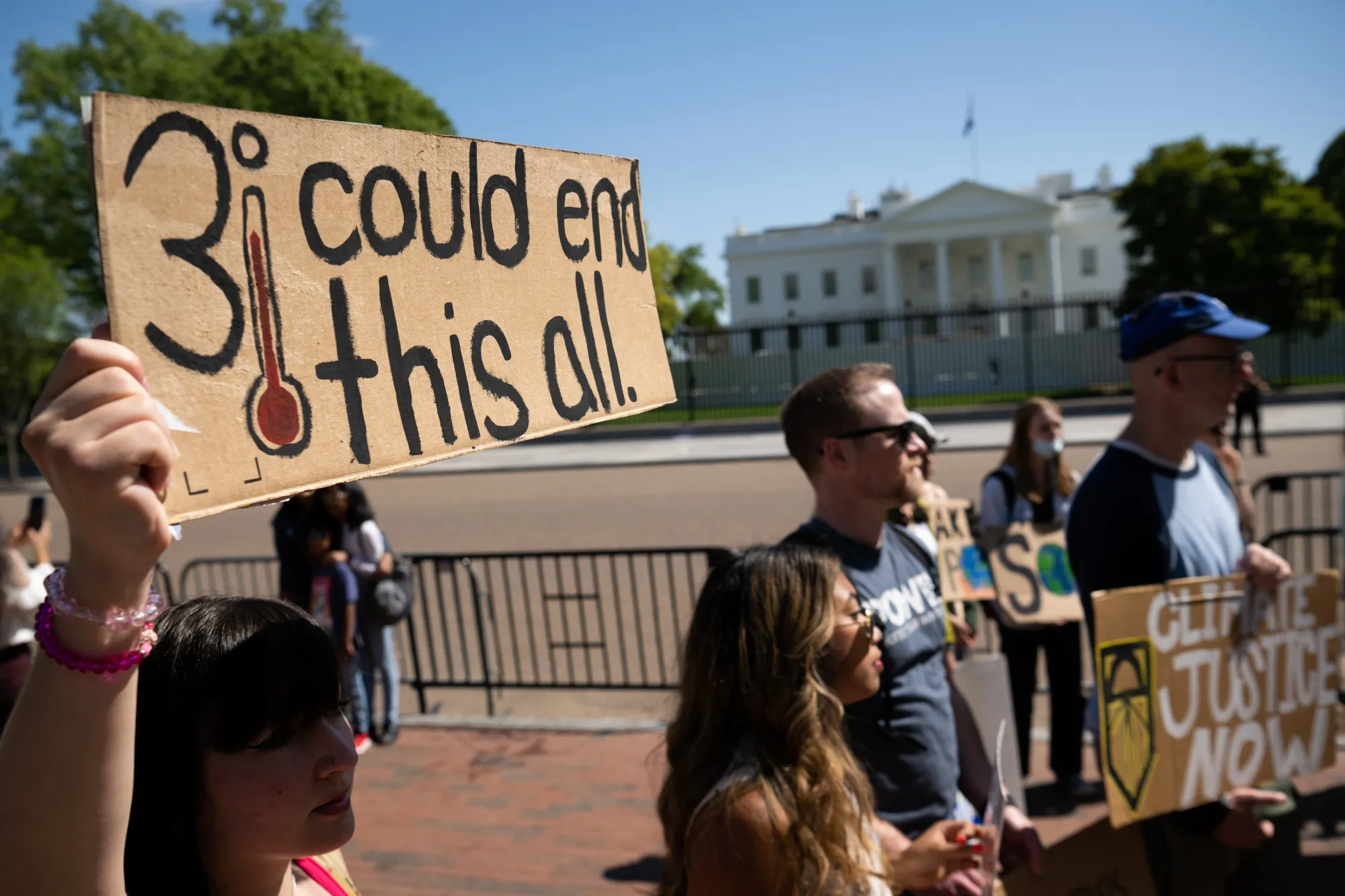 Demonstrators protest outside the White House on Earth Day in 2022.
