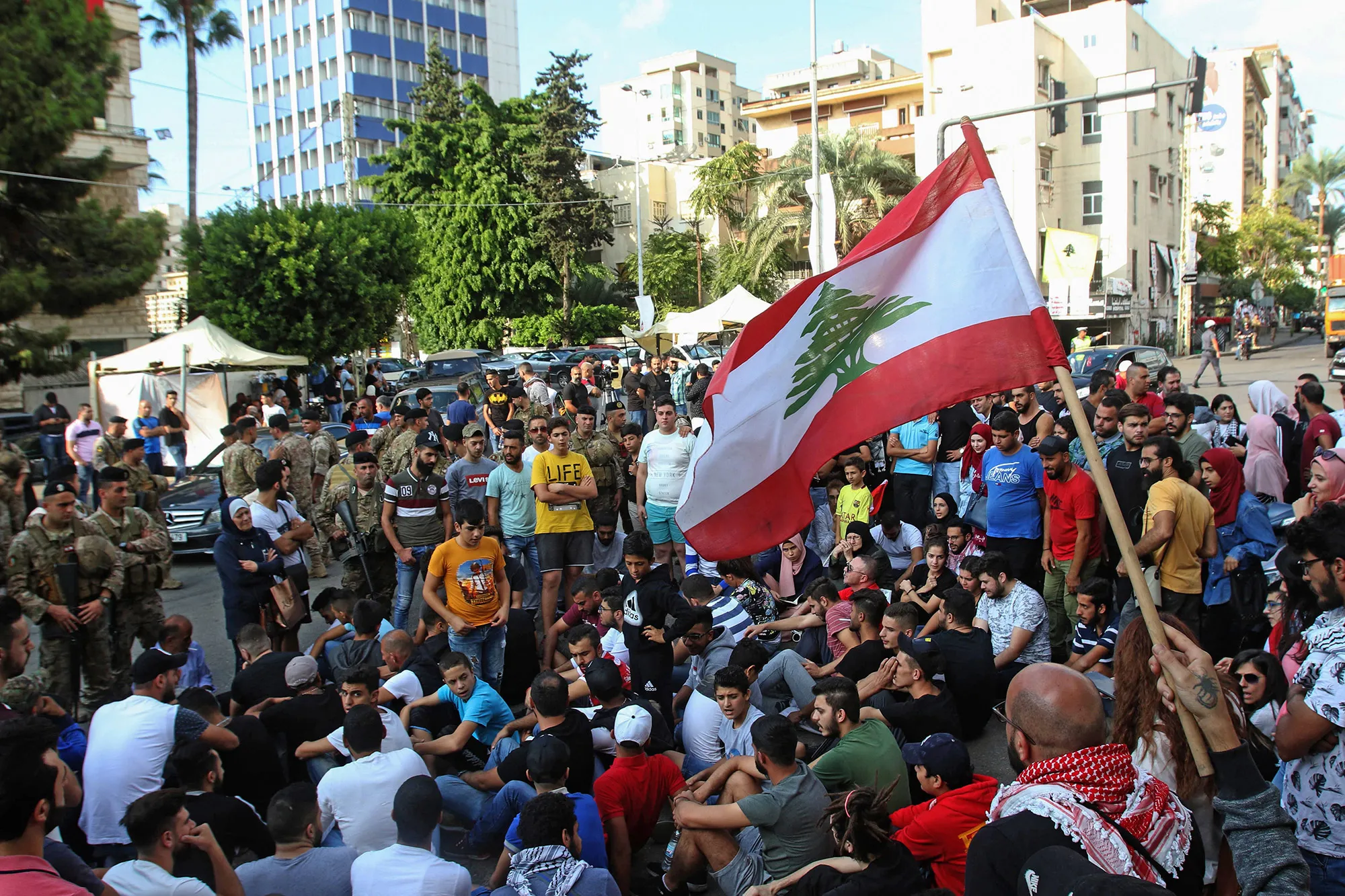 Lebanese protesters sit on the ground to block a venue on Nov.&nbsp;1.