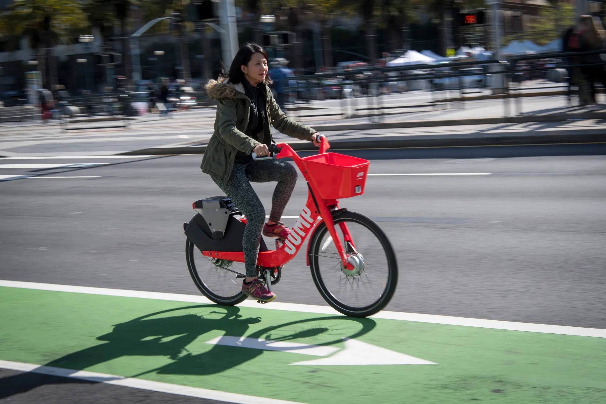 A person rides a Uber Technologies Inc. Jump Bike pedal electric bicycle in San Francisco, California, U.S.
