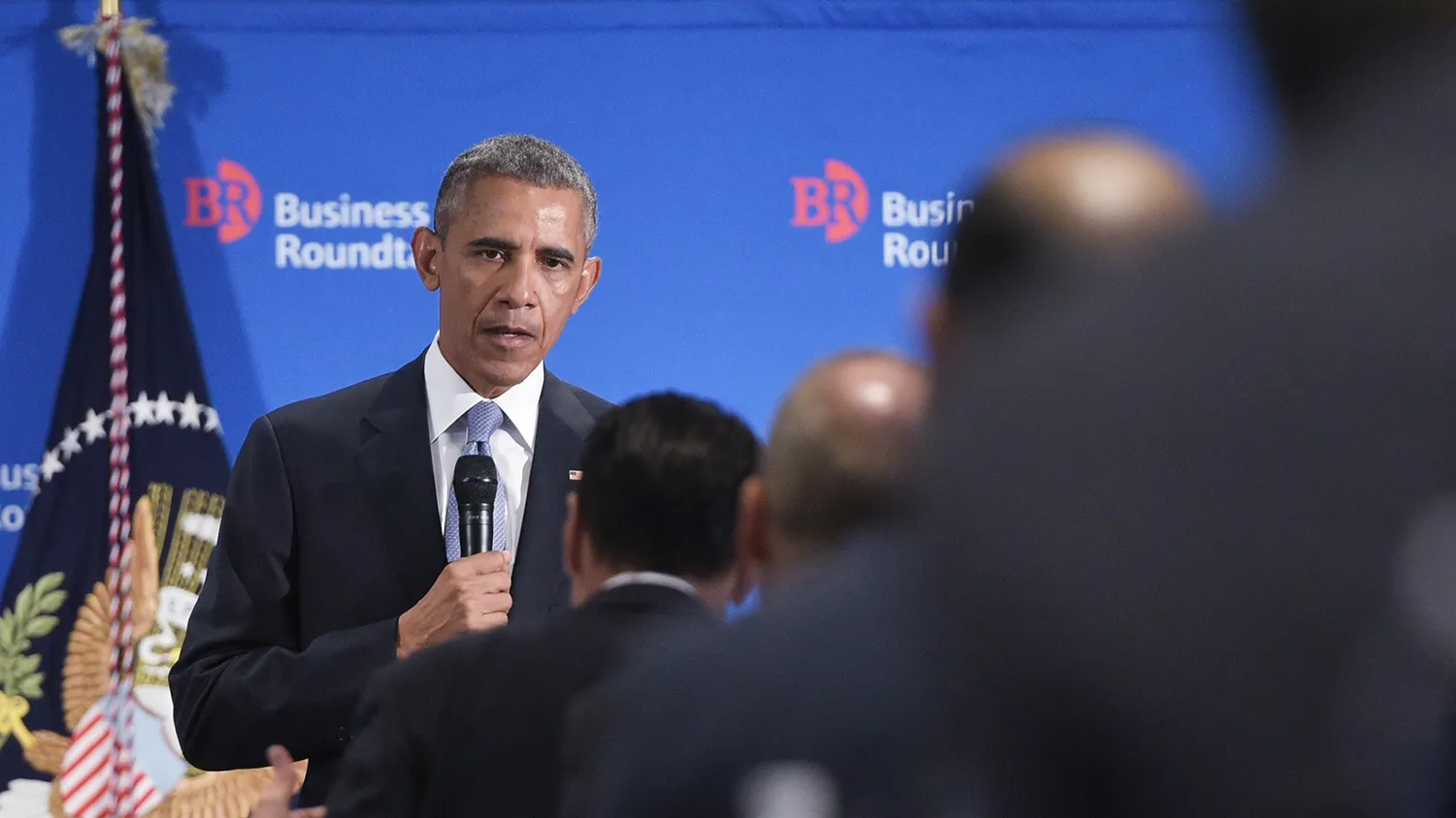 US President Barack Obama listens to a question from a member of the Business Roundtable at their headquarters in Washington, DC on September 16, 2015.
