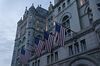 American flags hang outside the Trump International Hotel in Washington, D.C, U.S., on Thursday, April 23, 2020. Although the Trump family business was explicitly prohibited from benefiting from federal aid authorized in the last few weeks by Congress, its hotel in Washington is seeking separate relief on $3 million of annual rent that it pays to the U.S. General Services Administration the New York Times reported this week.