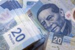 The portrait of Benito Juarez on a twenty Mexican Peso bill is seen in an arranged photograph in Mexico City, Mexico, on Wednesday, Jan. 27, 2016. Mexico’s peso, the worst performing major currency in 2016, is poised for a rebound by the end of this year, according to its most-accurate forecaster, Sireen Harajli, a strategist for Mizuho Bank Ltd. who was the best analyst for the peso in the fourth quarter, according to a Bloomberg ranking.
