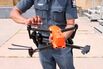 Park Ranger holds a drone that will patrol Long Island waters this summer for sharks