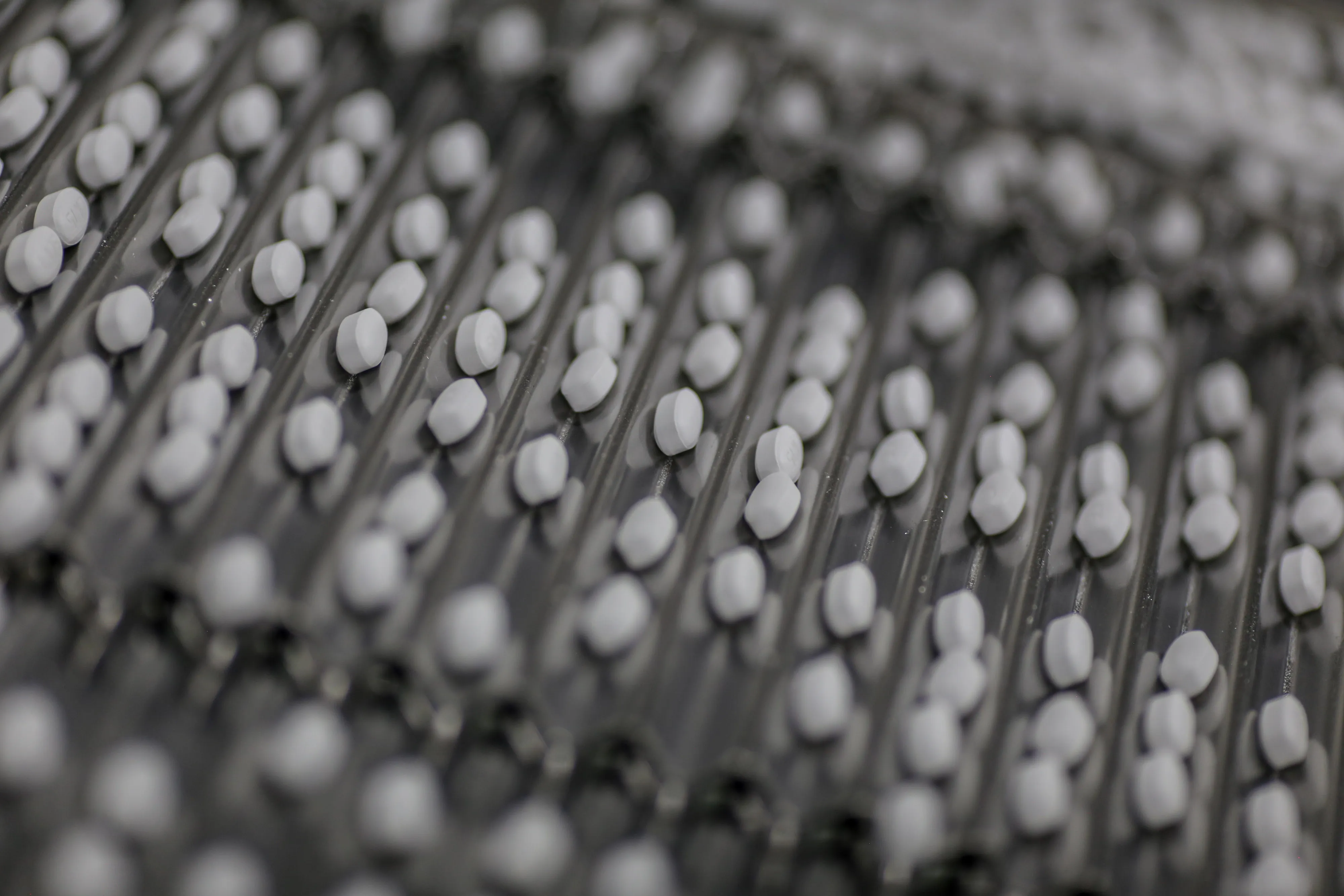 Medications move along a conveyor at a factory.&nbsp;