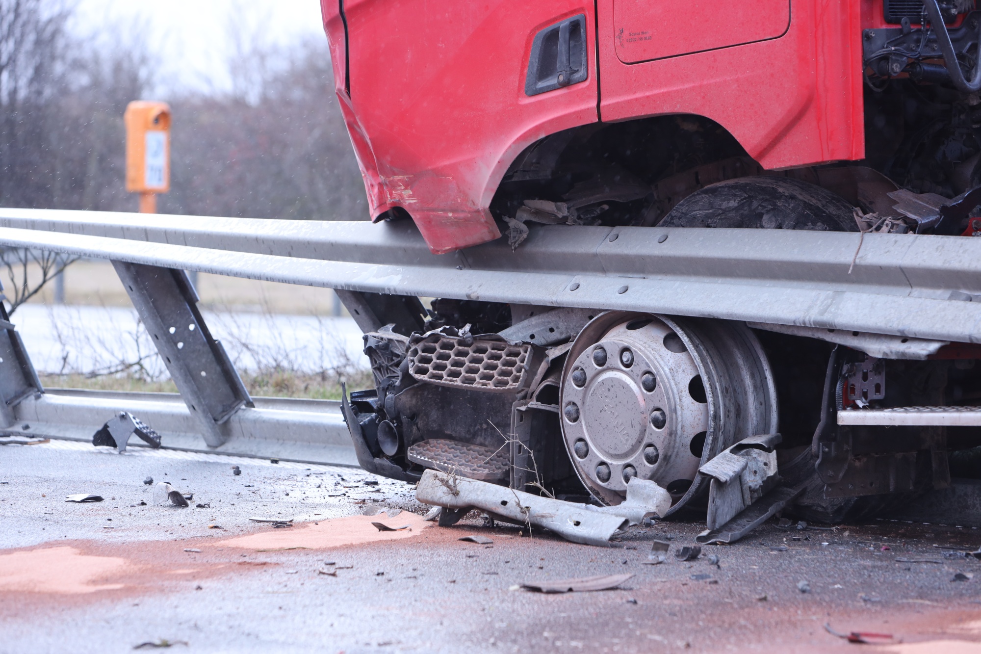 16 February 2022, Saxony-Anhalt, Ilsenburg: A truck is stationary on the median strip of highway 36. Due to a tire blowout, the truck broke through the central guardrail between Isenburg and Wernigerode and came to a stop there. The guard rail was damaged over a length of around 90 meters. The section of freeway had to be temporarily closed for the clean-up work and for the recovery of the truck. Photo: Matthias Bein/dpa-Zentralbild/dpa (Photo by Matthias Bein/picture alliance via Getty Images)