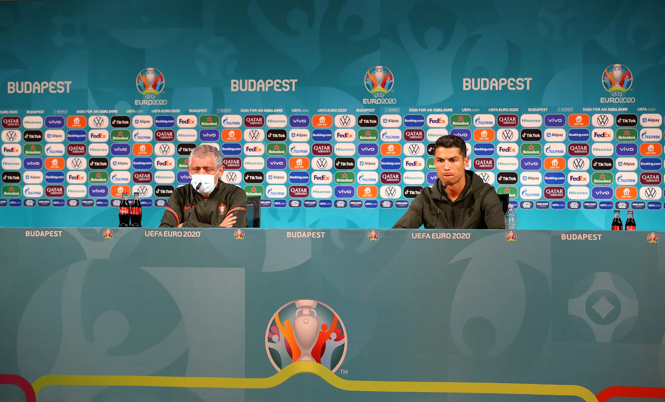 Cristiano Ronaldo, right, after pushing bottles of Coca-Cola away during the Portugal Press Conference ahead of the Euro 2020 Group F match between Hungary and Portugal on&nbsp;June 14.