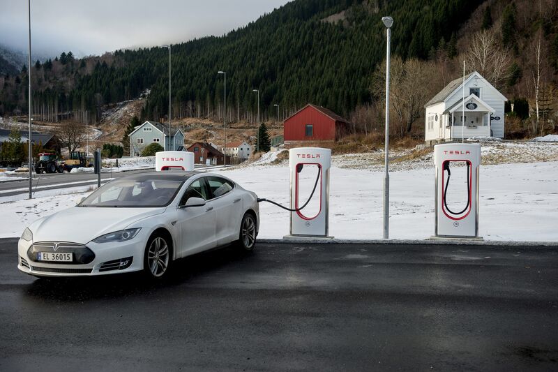 A Tesla automobile stands charging at a Tesla Inc. charging station in Lavik near Bergen, Norway.