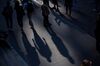 Pedestrians walk along Wall Street near the New York Stock Exchange (NYSE) in New York, U.S., on Friday, Oct. 5, 2018. A severe sell-off in technology stocks has pushed the front-month VIX futures contract to a premium relative to the second-month contract.
