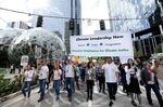EATTLE, WA - SEPTEMBER 20: Amazon and other tech employees walkout past the Amazon Spheres during the Global Climate Strike on Sept. 20, 2019 in Seattle, Washington. 