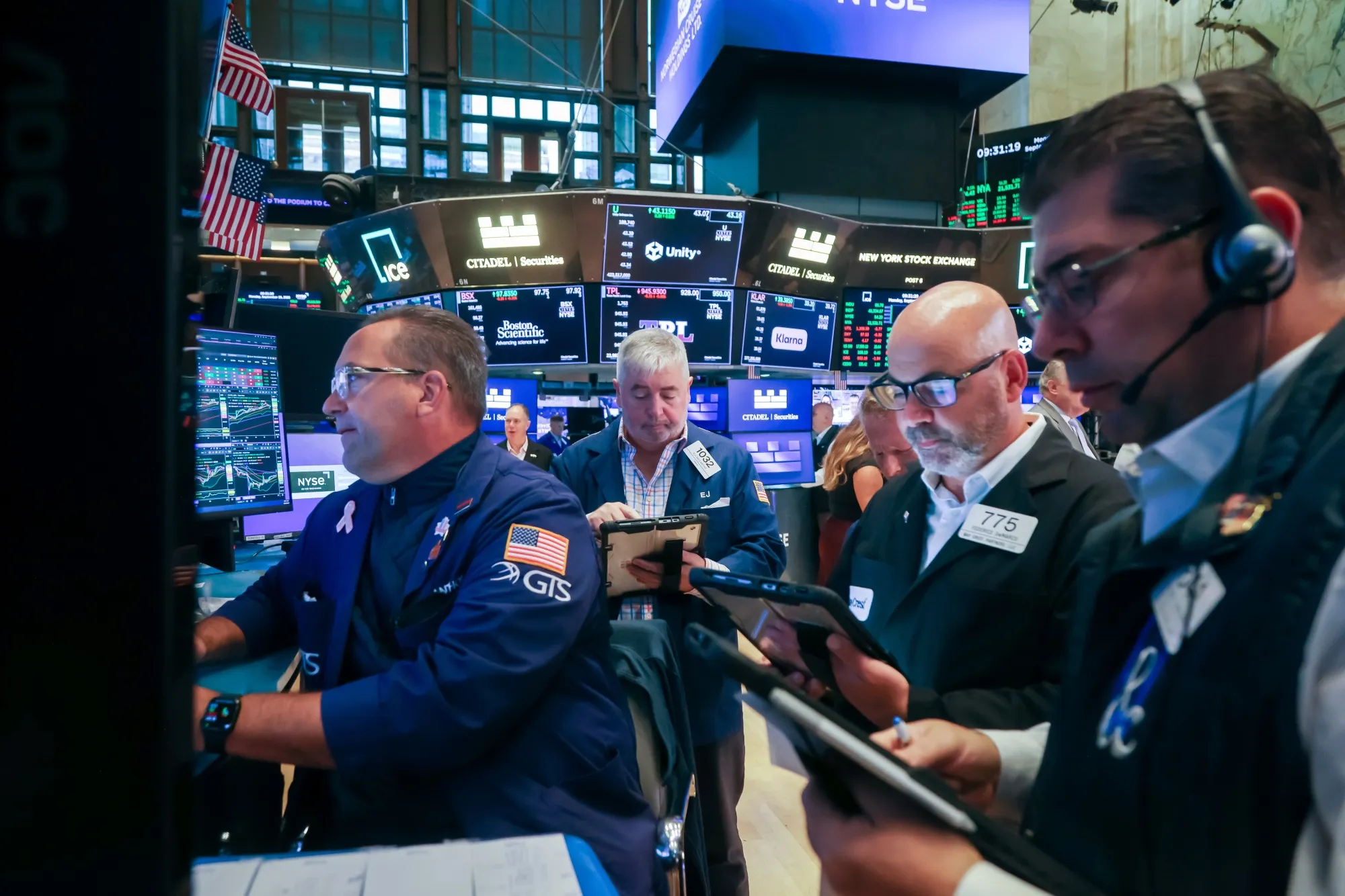 Traders work on the floor at the New York Stock Exchange.