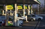 Vehicles refuel at a BP Plc petrol station near Chelmsford, U.K.