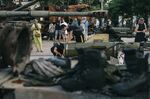 Visitors look round destroyed Russian military equipment displayed at St. Michael's Square in Kyiv, Ukraine.