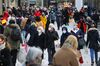 Shoppers wear protective face masks on a crowded retail high street in Frankfurt, Germany, on Monday, Dec. 14, 2020.