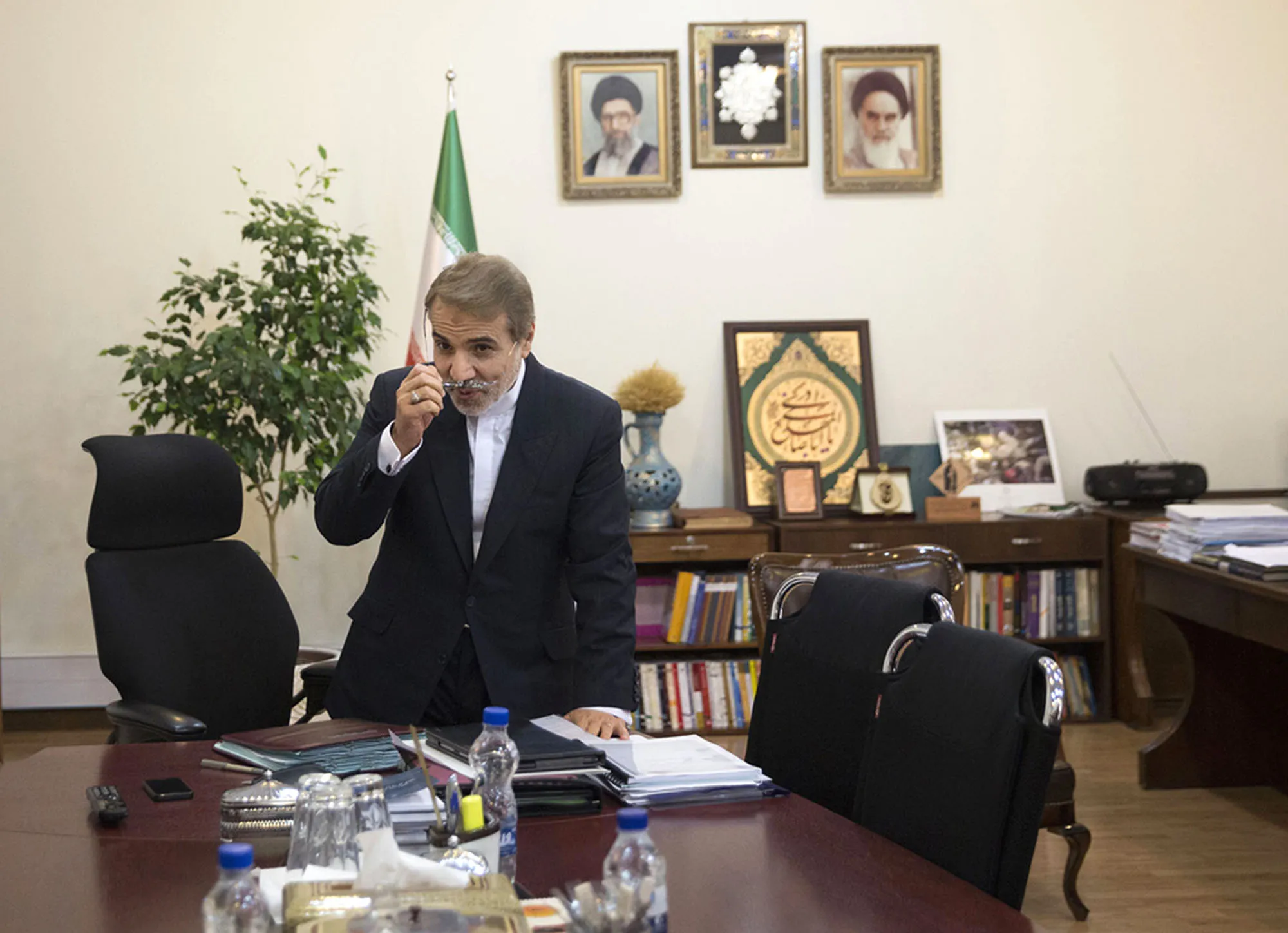 Iran's Vice President Mohammed Bagher Nobakht at work in his office in Tehran. Photographer: Simon Dawson/Bloomberg
