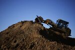 A Caterpillar Inc. 953D crawler loader dumps a load of dirt while digging out a foundation for a home under construction in the Norton Commons subdivision in Louisville, Kentucky, U.S., on Tuesday, Oct. 6, 2020. The U.S. Census Bureau is scheduled to release housing starts figures on October 20.