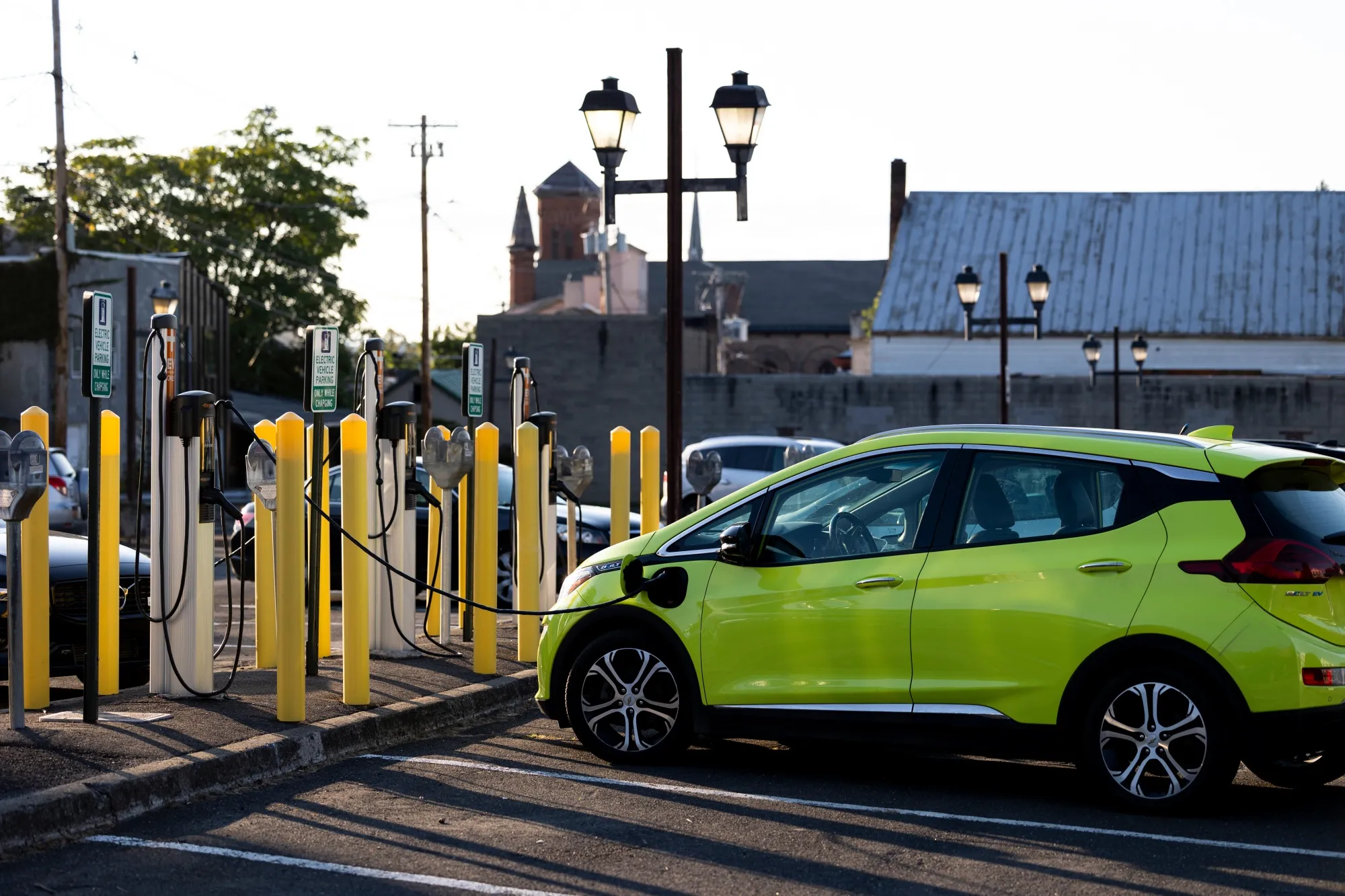 A vehicle charges at an electric vehicle charging station in Hudson, New York.