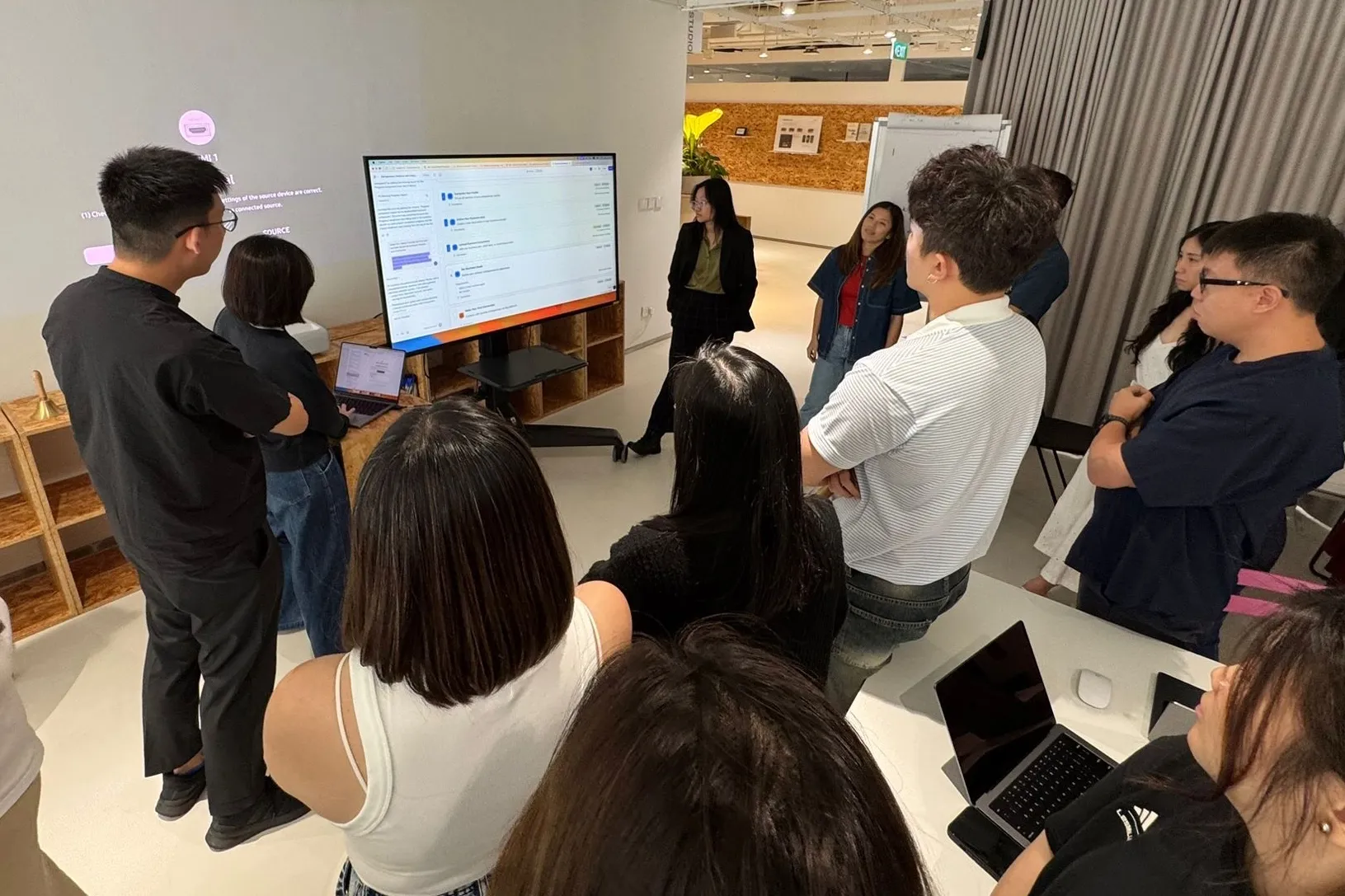Bank staff gather for a hands-on AI literacy workshop at OCBC’s Singapore headquarters.