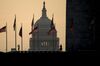The U.S. Capitol building stands past visitors taking photographs at the Washington Monument in Washington, D.C., U.S., on Tuesday, July 11, 2017. As Congress returned from its mid-summer break yesterday for a crucial three-week stretch, several obstacles await lawmakers, including an ongoing health-care fight, divisions among Republicans on the basic parameters of a tax bill, and a maelstrom of upcoming deadlines to keep the government running and avert a catastrophic default on U.S. debt.