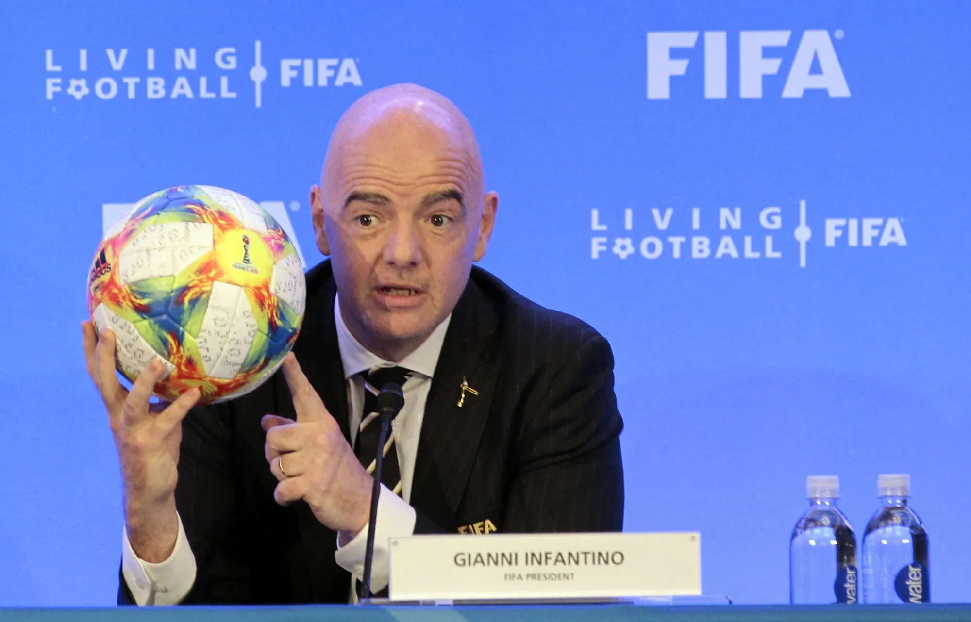 FIFA President Gianni Infantino holds a soccer ball as he speaks during a press conference after the FIFA Council Meeting, Friday, March 15, 2019, in Miami. FIFA is moving more than 100 jobs from its Swiss headquarters to Florida where a growing workforce is already working on organizing the 2026 World Cup. FIFA informed staff Tuesday, Sept. 26, 2023 the entire legal department plus audit, compliance and risk management teams will move from Zurich to Coral Gables near Miami. (AP Photo/Luis M. Alvarez, File)