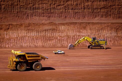 Rio Said to Pursue $5 Billion Iron-Ore Project as Glut Looms