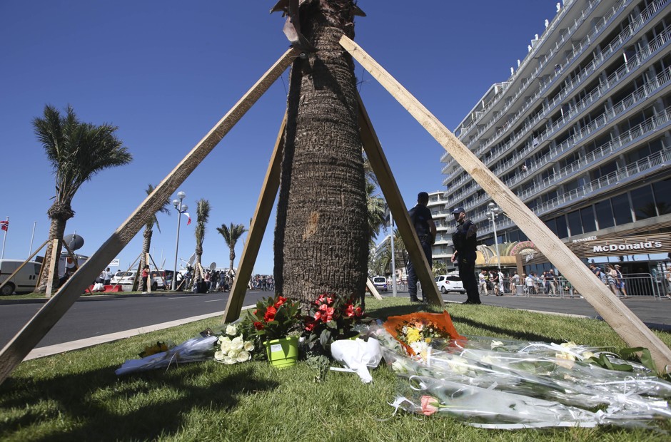 Flowers are placed at the scene of the July 14 attack in Nice, France.
