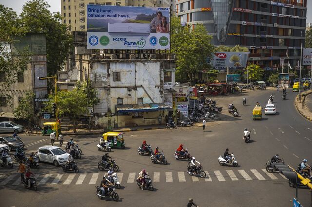 A big billboard of a air conditioning brand installed on a traffic junction in Ahemdabad, Gujarat, India, on Friday, May 6, 2023. Photographer: Prashanth Vishwanathan/Bloomberg