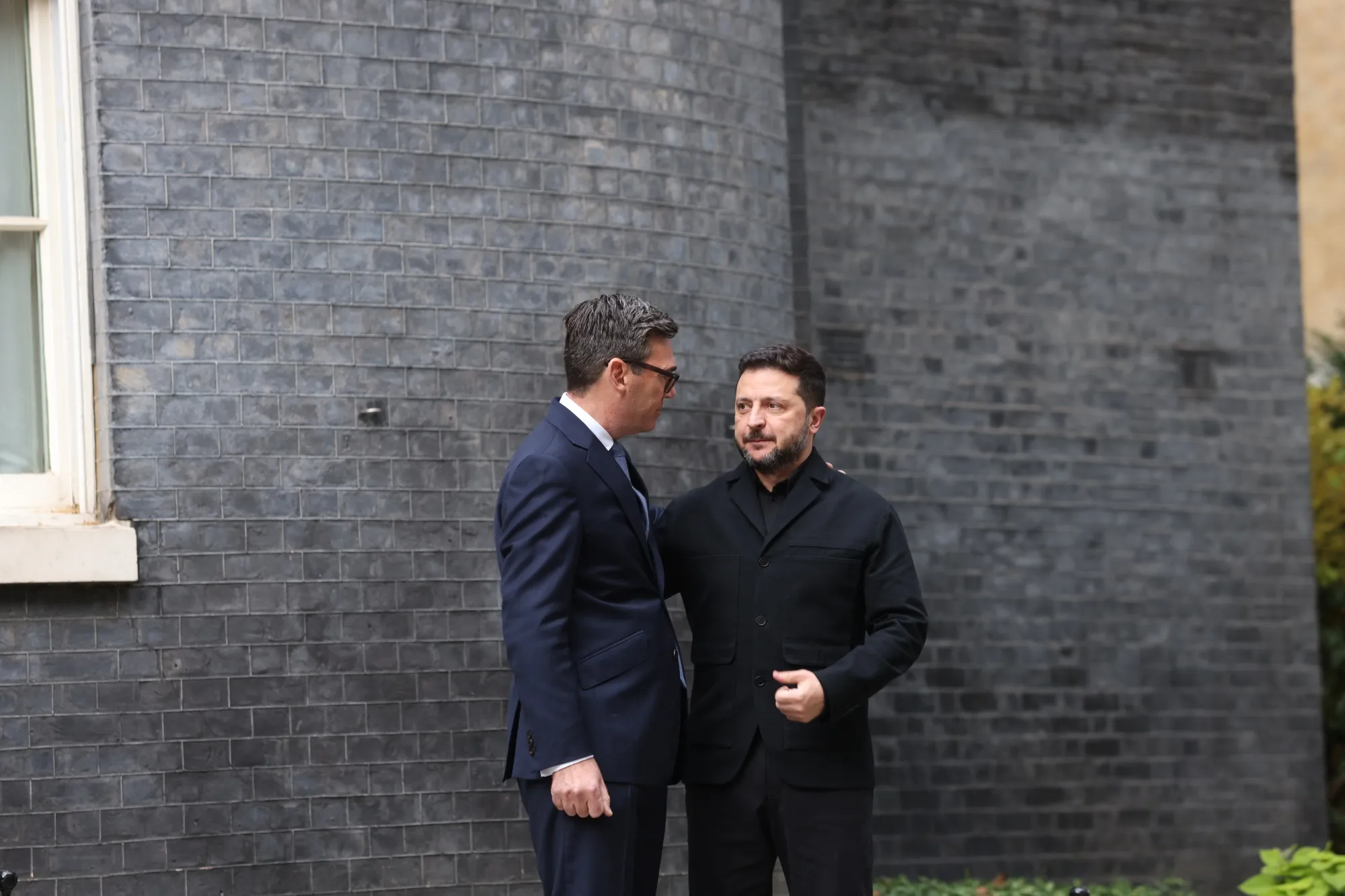 UK Prime Minister Andy Burnham, left, greets Ukrainian President Volodymyr Zelenskyy.
